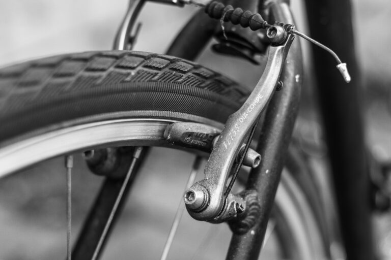 grayscale photo of bicycle wheel